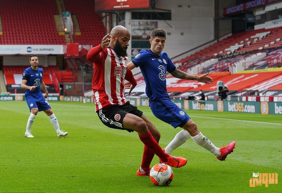 30652952 8512519 McGoldrick attempts to retain possession for Sheffield United wh a 22 1594492234613